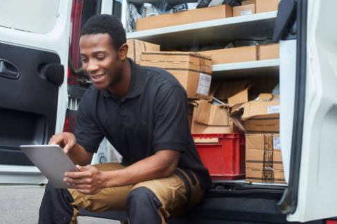 Contractor reviewing work on tablet